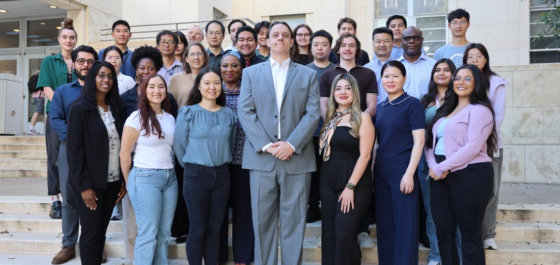 Group of individuals in front of Main Baylor campus