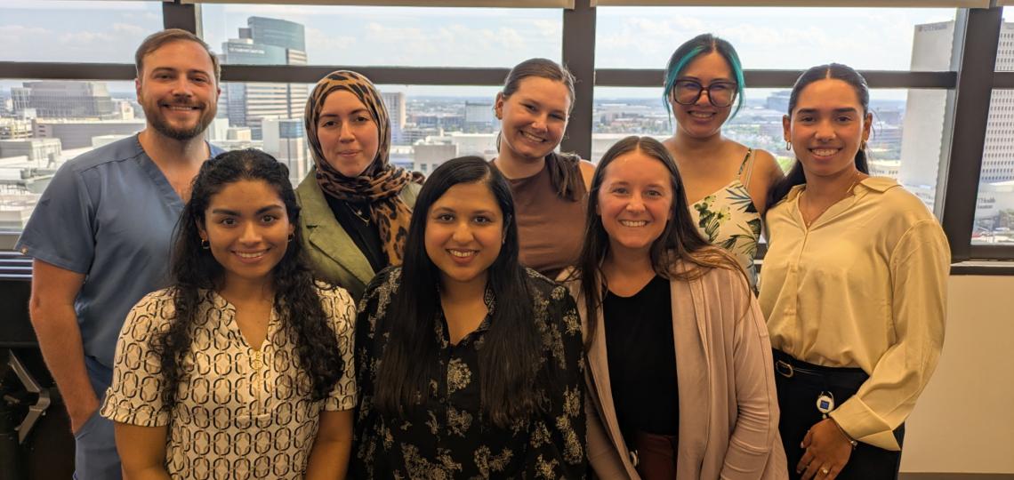 group of people standing together smiling