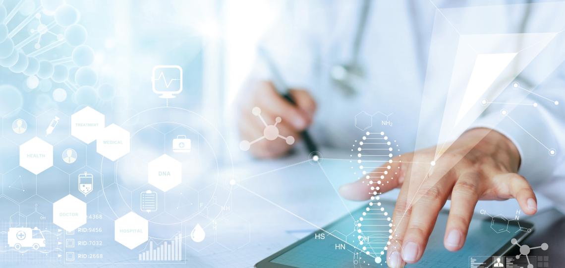 fingers on a tablet, with a pen in the other hand