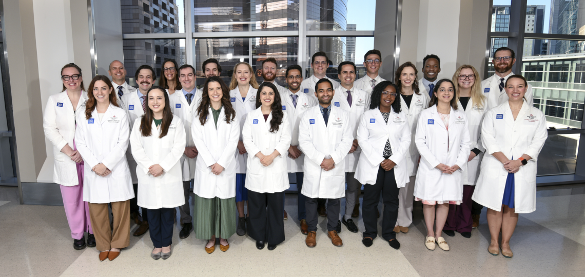 group of pediatric cardiology fellows standing together, smiling