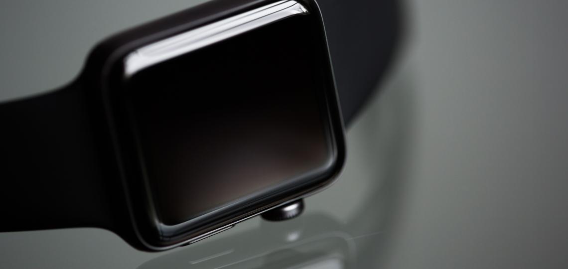 Photo of a smart watch on a black background.