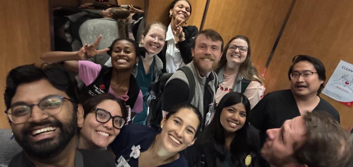child neurology residents group photo on elevator