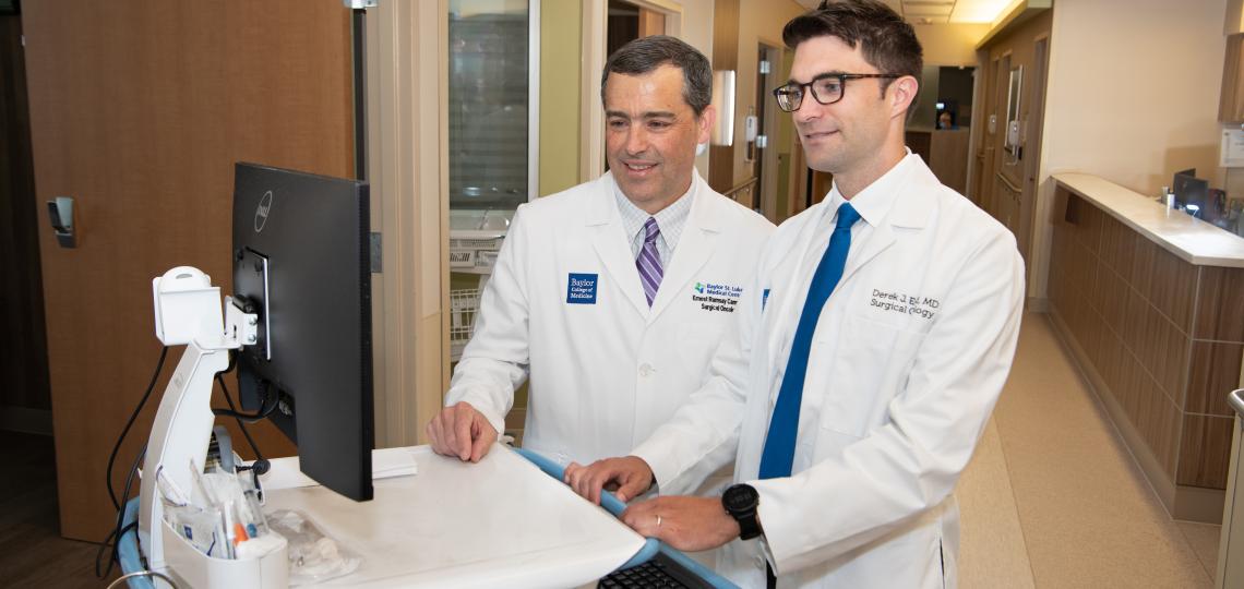 Drs. E. Ramsay Camp and Derek Erstad in the clinic