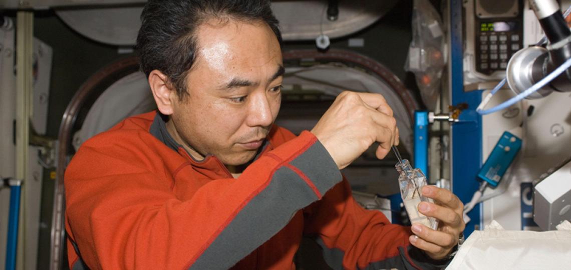 JAXA astronaut Satoshi Furukasa working on Plants in Space.