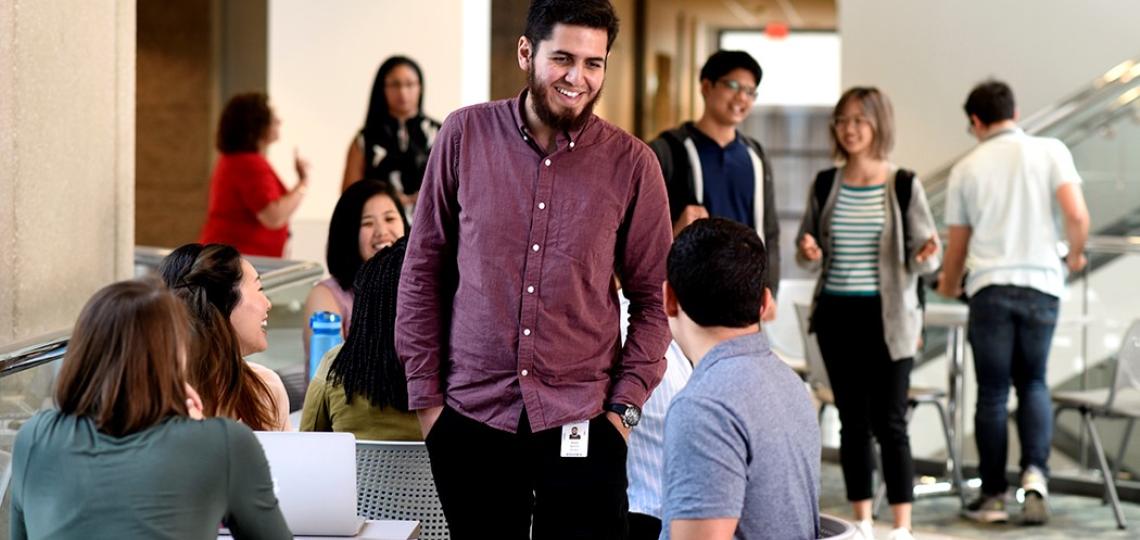 Graduate students gathering on campus.
