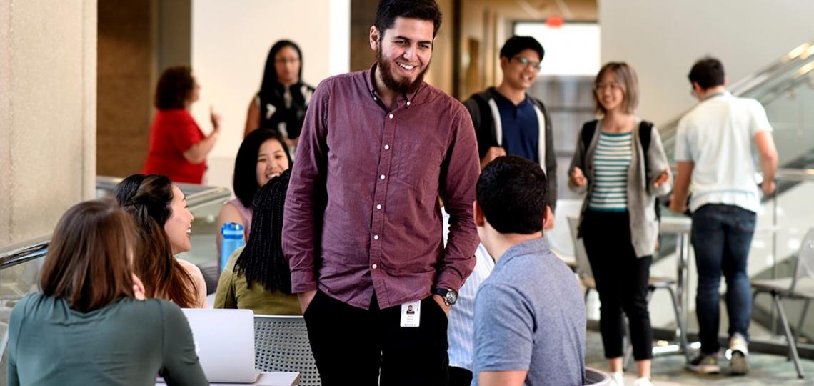Graduate students gathering on campus.