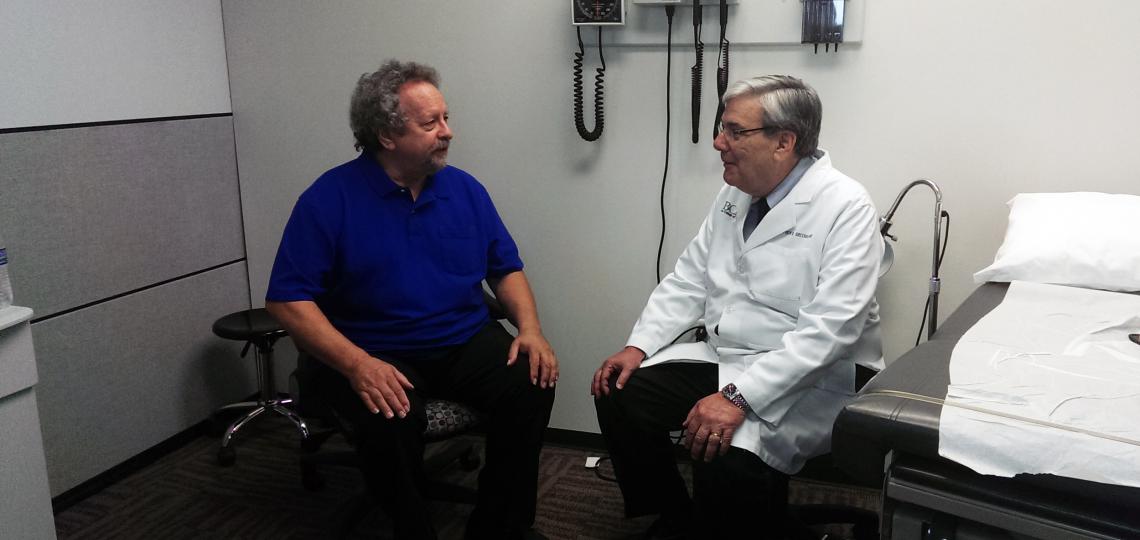 Dr. Greenberg talking with a simulated patient.