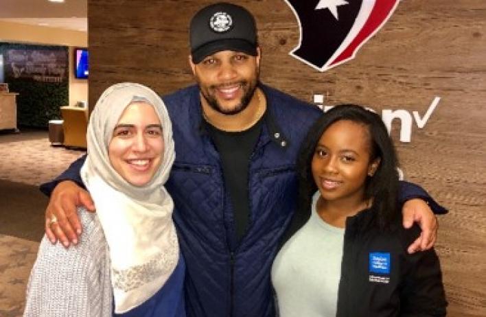 Dermatology residents with a player from the Texans