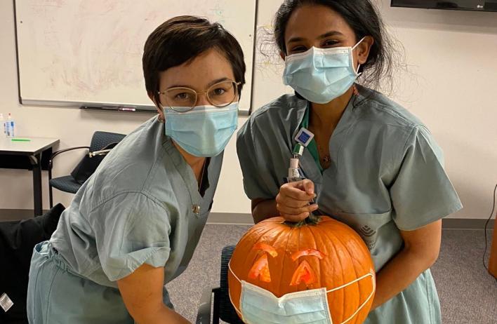 Drs. Cook and Ajjarapu get creative with their social distanced Jack OâLantern.