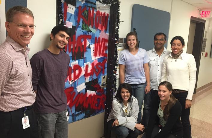 Winners of the Halloween door contest and pizza for the lab