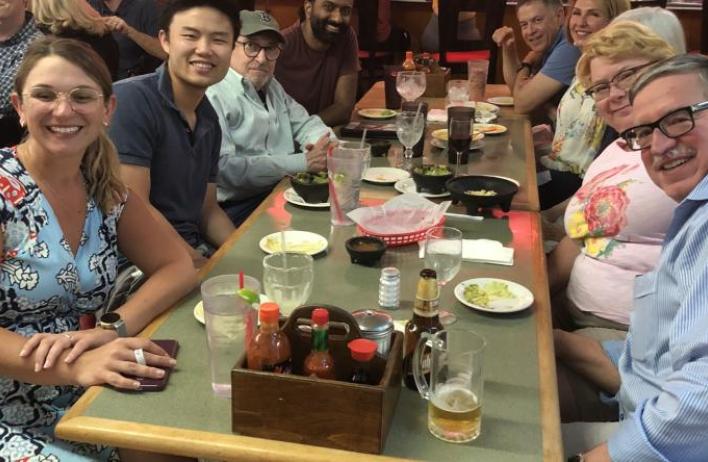 Residents and faculty enjoy dinner together.