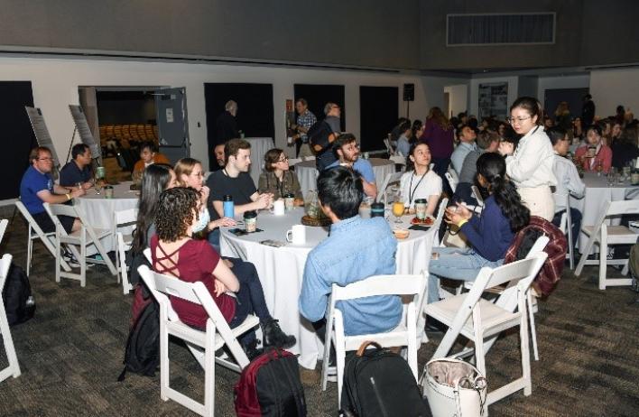 People at the Research Retreat at the Houston Zoo seated for a meal