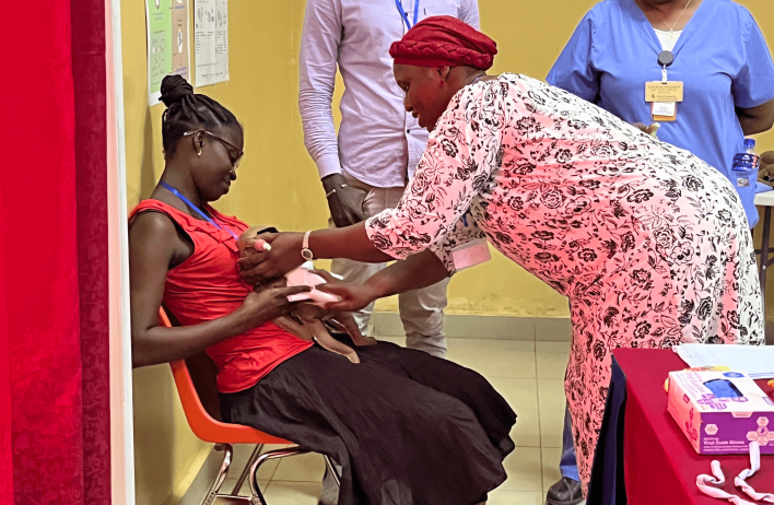 A mother being helped with her child