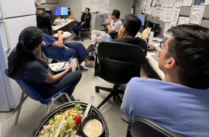 Students eating lunch together in the lab