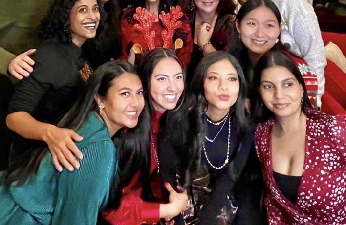 Group of people dressed nicely smiling