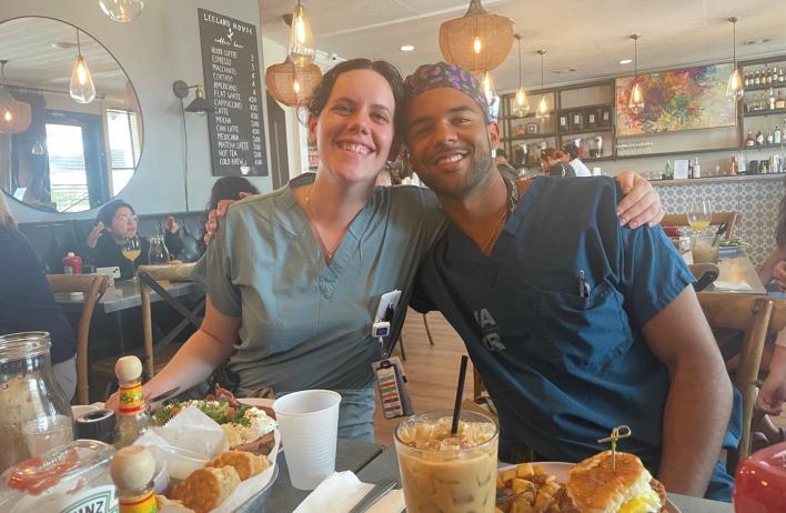 two people smiling at breakfast