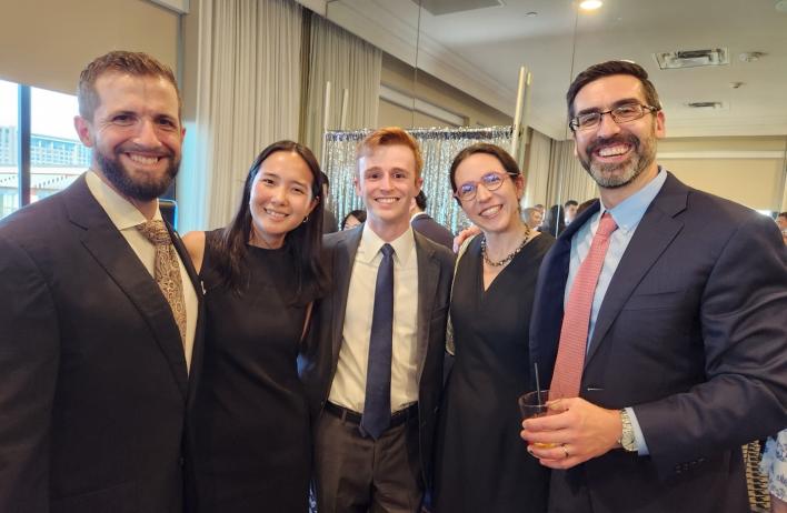 people dressed nicely smiling