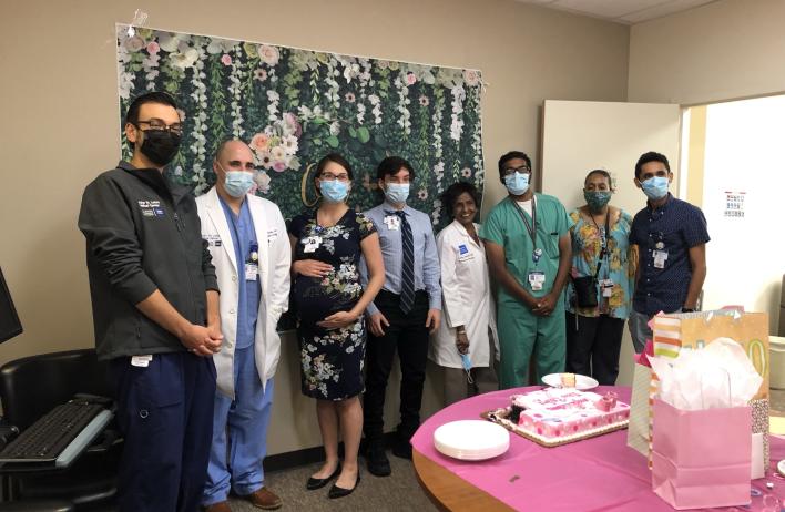 residents celebrating their teammate's pregnancy