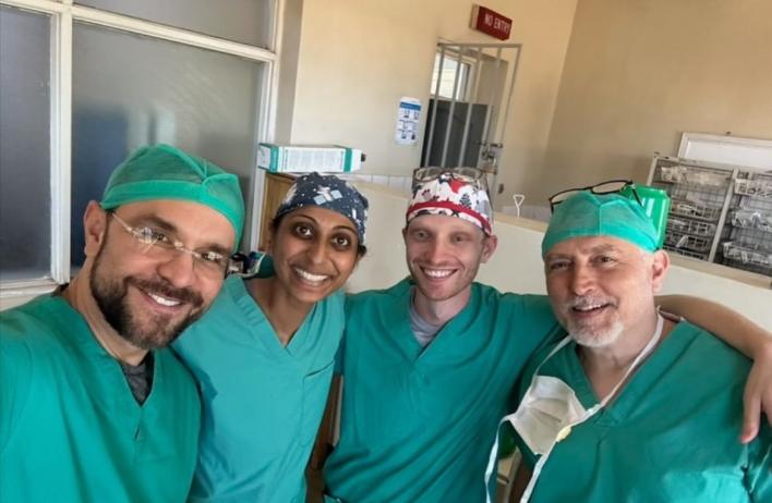 Four global health doctors smiling