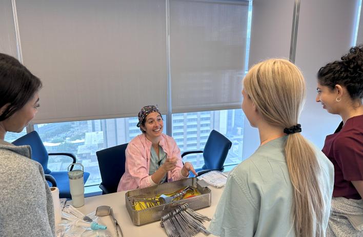 OB/GYN residents looking at tools