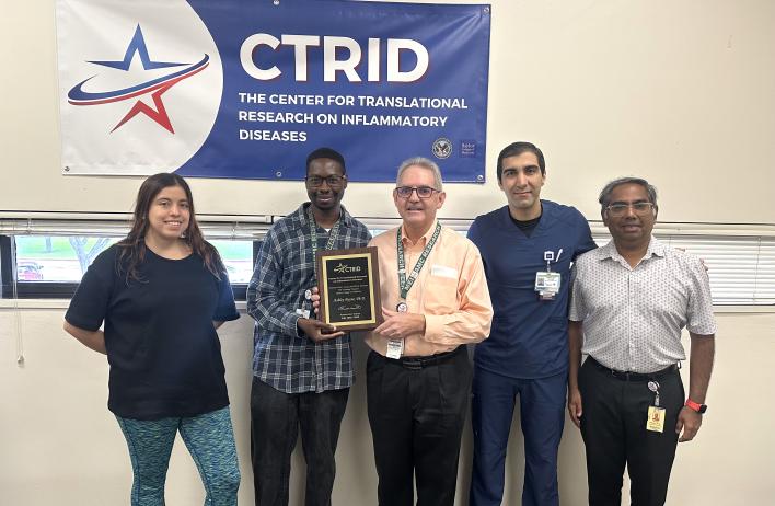 AY25 T32 Graduation Session. Graduate: Dr. Ashley Payne. Left to right: Drs. Andrea Salinas, Ashley Payne, Rolando Rumbaut, Mohammad “Mo” Saadatagah, and Vinod Vijayan.