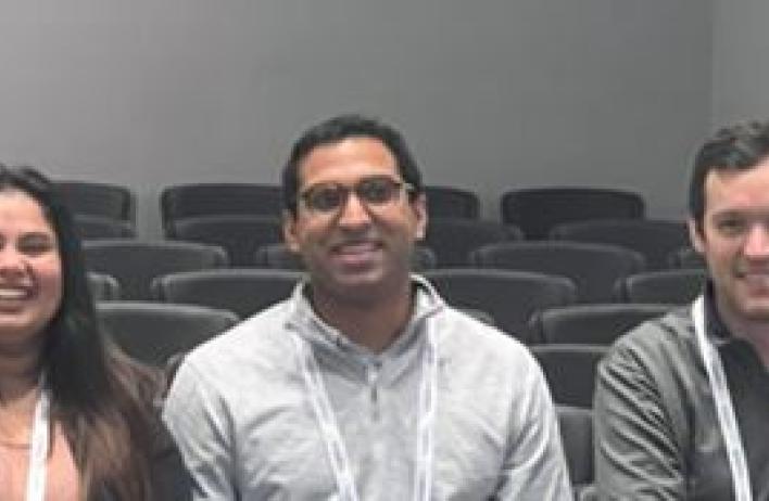3 people sitting together smiling