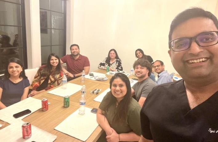 people smiling at a table