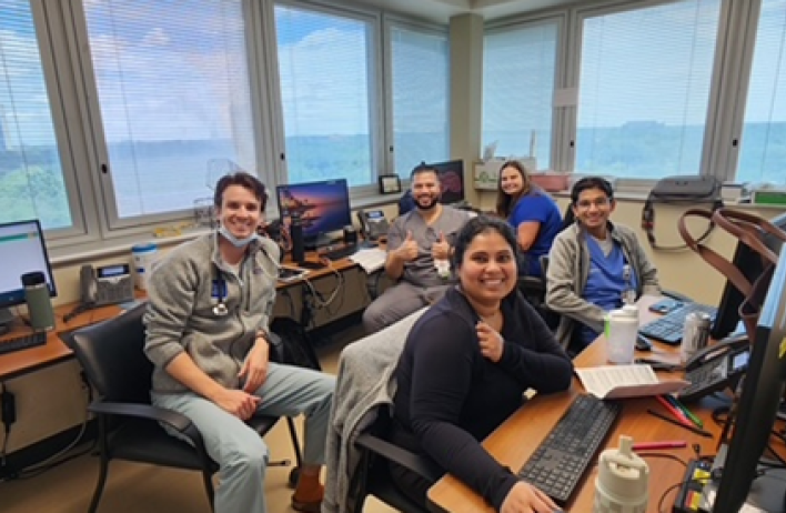 group of people sitting down and smiling