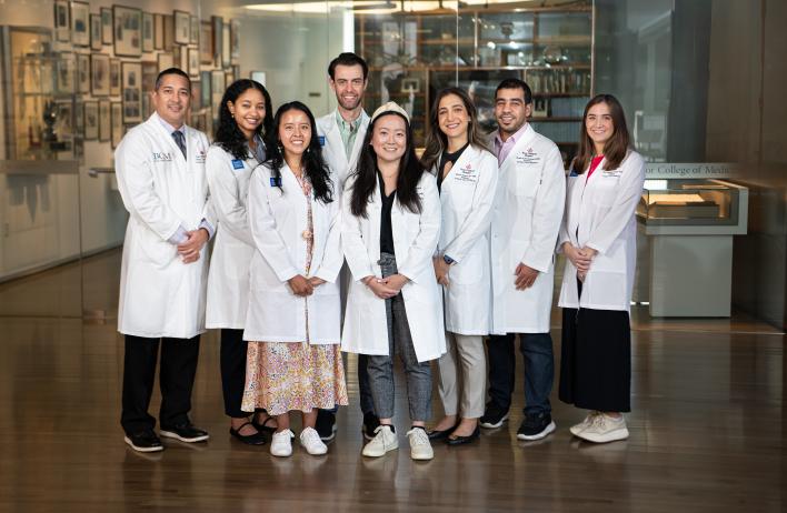 a group of doctors standing together smiling
