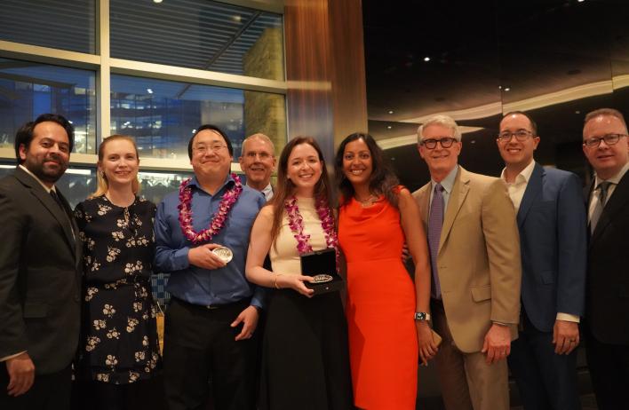 a group of people dressed nicely, smiling