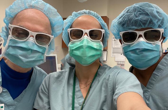 3 doctors in scrubs and face masks