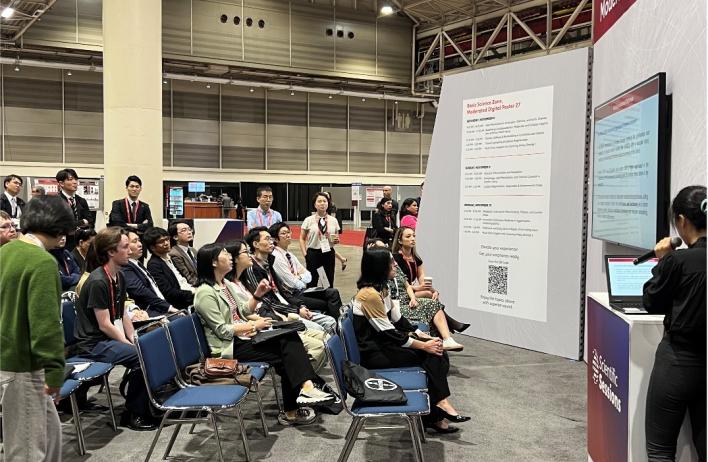 people watching a scientific presentation