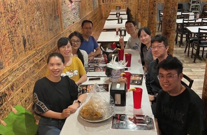 lab members eating meal at Juicy Crab