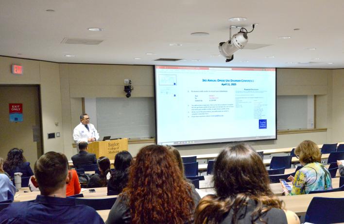 A seated group watching a presentation
