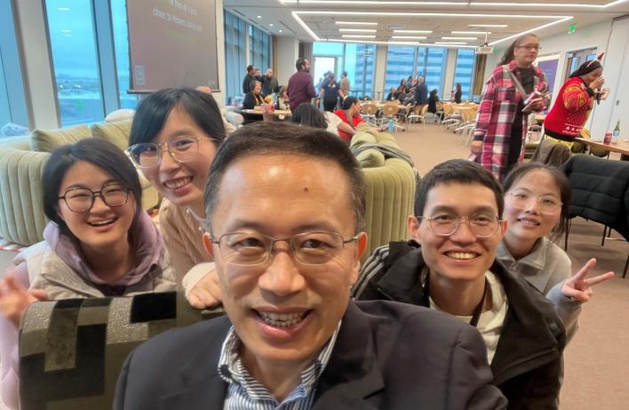 lab members smiling and enjoying their Christmas party