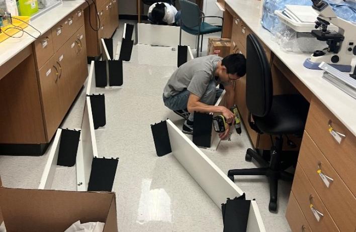 lab member helping build the lab