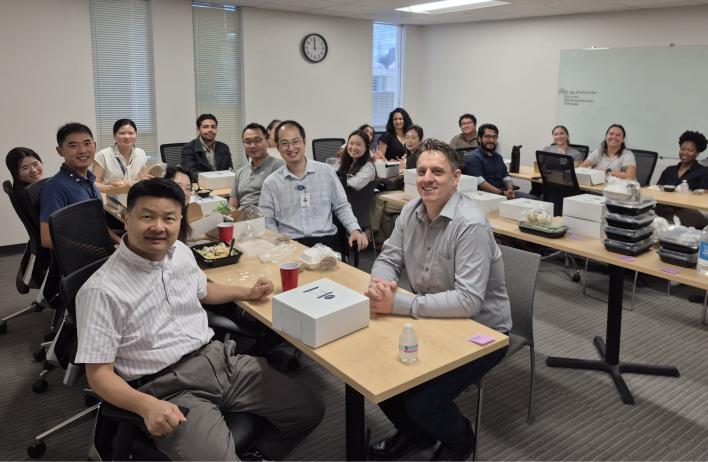 a large group of people enjoying thanksgiving dinner
