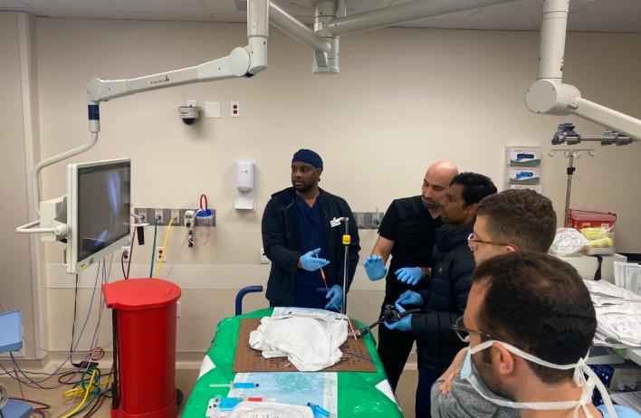 Dr. Ayoub teaching proper closure technique to trainees