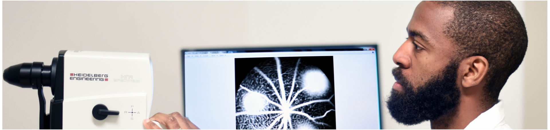 Doctor studying digital scanned images of the eye.