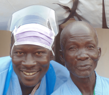 A doctor and patient smiling together