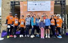 group of people posing for photo at benefit run