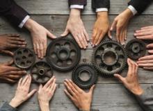 Photo of hands on gears