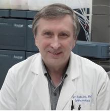 photo of male doctor in white coat smiling