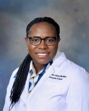 woman in doctor coat smiling