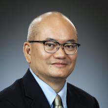 man with glasses smiling