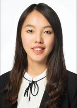 woman with long dark hair smiling