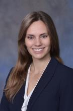 woman with light brown hair smiling