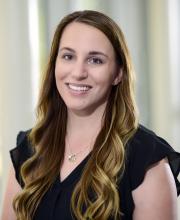woman with long blonde hair smiling