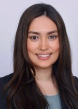 woman with dark brown hair smiling