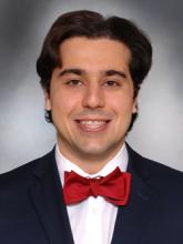 man with a bowtie smiling